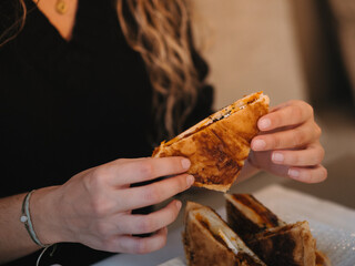 a woman eating a sandwich