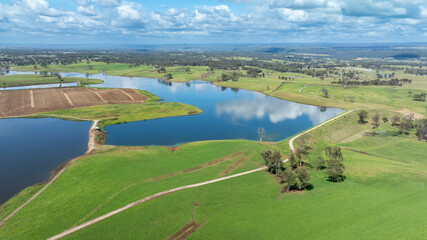 Drone aerial photograph of large irrigation dams in a large agricultural area in the regional township of Luddenham in New South Wales, Australia.