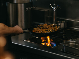 cooking in the kitchen of a restaurant