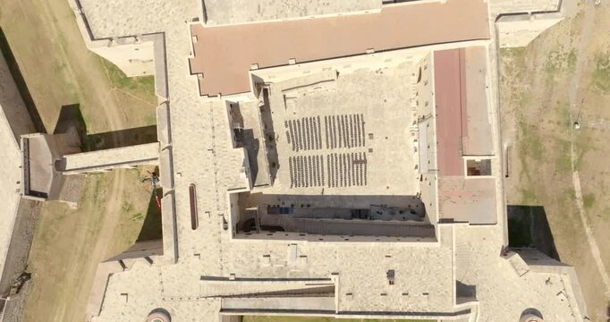 Perpendicular aerial view of the castle located in Barletta, Puglia, Italy. It was a medieval fortress built for defense and today it is a museum. There is a park around the fort.
