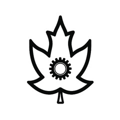 Obraz premium A black leaf with a black and white icon, representing the concept of black Gear