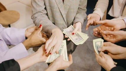 Close up of a business professionals hands holding and distributing cash, symbolizing corporate success, teamwork, and financial achievement - Powered by Adobe