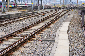 High angle view of railway track with gravel and concrete railway sleepers at Swiss railway station Zürich Altstetten on an autumn day. Photo taken November 11th, 2024, Zurich, Switzerland.