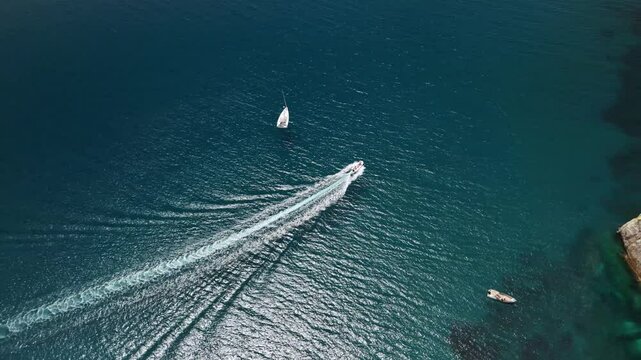 Exploring the breathtaking Porto Flavia in Sardinia, featuring stunning turquoise waters and boats