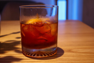 Whiskey Cocktail with Ice and Citrus Twist