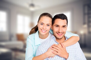 Happy, hug young couple posing at home