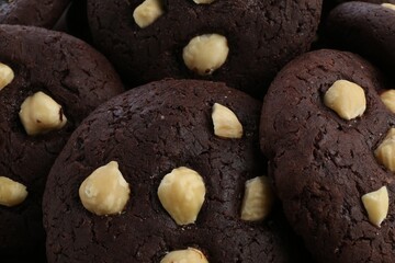 Tasty chocolate cookies with hazelnuts, closeup view