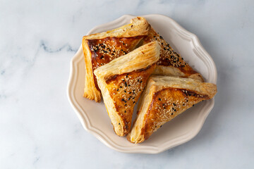Homemade triangle puff pastry with cheese - Turkish name; milfoy borek