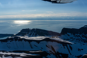 Breathtaking View of Snow-Capped Mountains Reflecting on Tranquil Lake