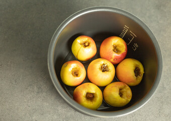 baked apples with honey and nuts in a slow cooker