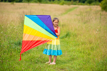 girl with a rainbow kite