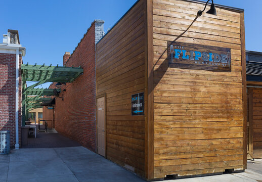 ROCK HILL, SC, USA-10 APRIL 2022: The Flipside Restaurant building exterior, with signs and alleyway entrance.