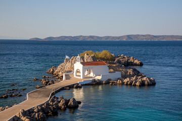 Authentic traditional Greek islands- unspoiled Chios, little church in the sea over the rocks Agios Isidoros. Eastern Aegean islands