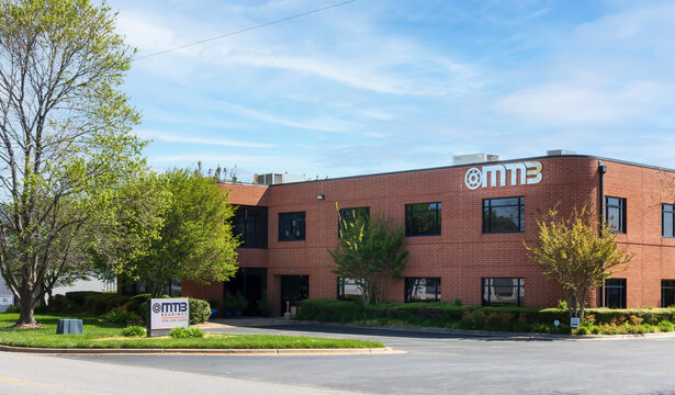 MOORESVILLE, NC, USA-17 APRIL 2022: MMB Bearings, building and monument sign, on sunny, spring day.