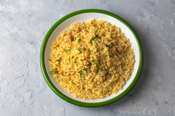From Turkish cuisine; Chickpea bulgur pilaf - Turkish name; nohutlu bulgur pilavi