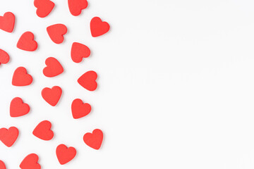 Overhead shot of red hearts on white background with copyspace. Flat lay