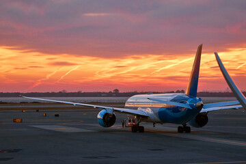 passenger plane takes off at dawn