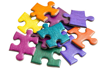 Obraz premium Colorful puzzle pieces arranged in an overlapping manner, showcasing a variety of vibrant hues and unique shapes.