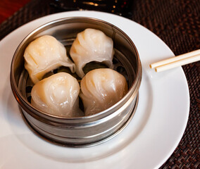 Steamed dumplings gyoza with meat filling from pork and cabbage. Traditional Japanese appetizer