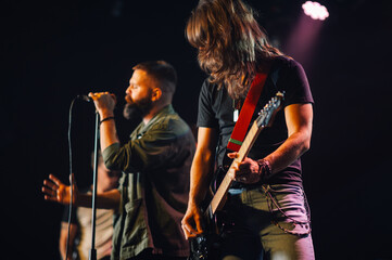 Guitarist and singer performing live on stage