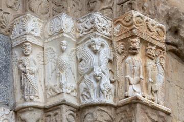 Pavia - The detail of Romanesque portal of church Basilica di San Michaele Maggiore