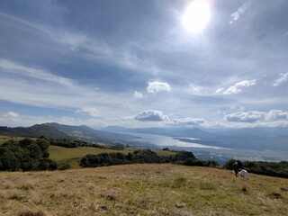 Incredible mountain view with stunning sun and lake on the horizon