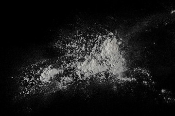 Wheat flour isolated on black, top view, clipping path