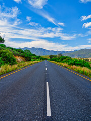Fototapeta premium Vertical view of road winding through Robertson wine valley, Langeberg Mountains in the background, Western Cape, South Africa