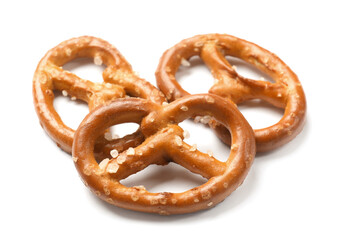 Many delicious pretzel crackers isolated on white