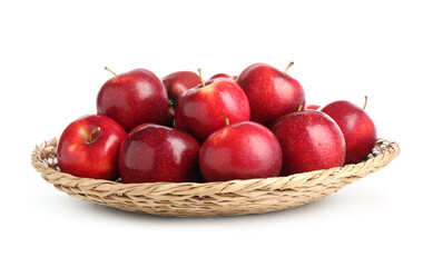 Fresh ripe red apples in wicker bowl isolated on white