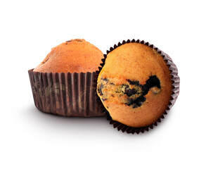 Tasty blueberry muffins in cupcake liners isolated on white