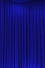 blue theater curtain that dropped down as a straight line. Background for inserting text, empty spaces