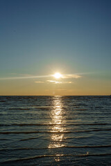 Tranquil sunset over calm ocean waves