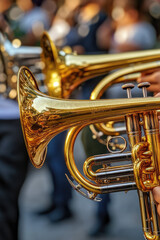 Close-up of brass band instruments, trumpets, during a celebration and street parade, copy space