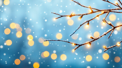 Winter twinkle lights on bare branches against blue sky