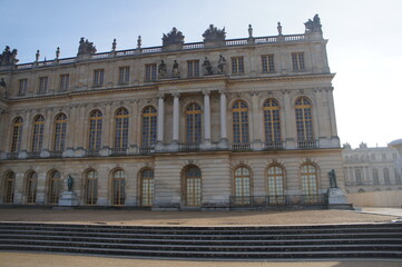Fototapeta premium Exterior view of the Palace of Versailles, its landscapes, architecture, and gardens