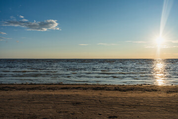 Tranquil sunset over calm ocean waves