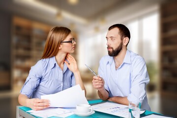 Two happy professionals business partners checking document