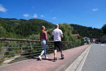 Disability man walking on a scenic path with a friend