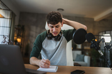 Fototapeta premium Young man blogger prepare for new video at home studio