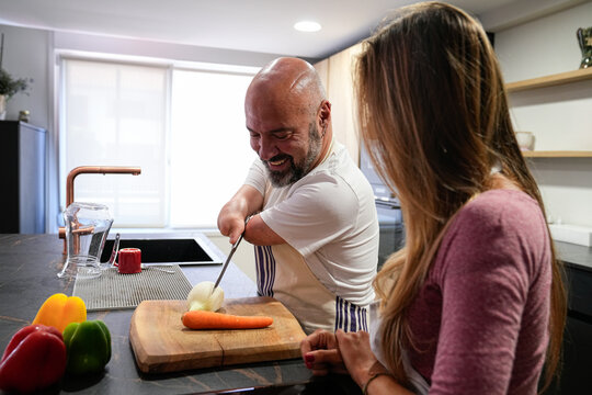 Disability man cooking independently with joy and confidence