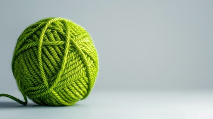 Soft green yarn ball ready for your next knitting project, perfect for creating cozy garments or home decor.