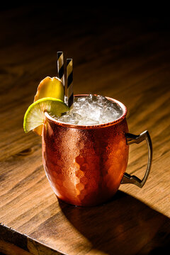 Moscow mule cocktail in a copper mug with lime garnish