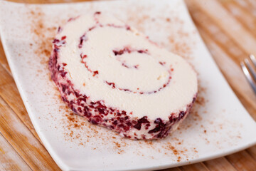 Slice of tasty cheese roll filled with cranberries