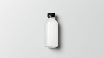 A clean, minimalist bottle with a black cap against a white background, showcasing its simple and modern design.