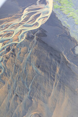 Fototapeta premium Glacial River in Iceland from above, top view, beautiful glacial runoff, mineral river