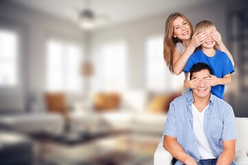 Cheerful smiling family sitting in the living room