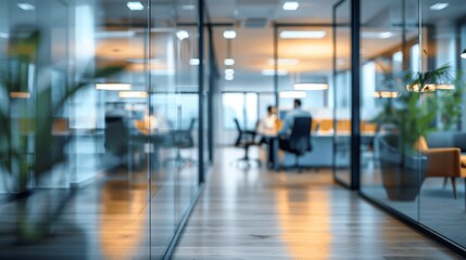 Modern office with it specialists and programmers working behind glass wall