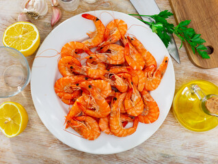 Seafood appetizer. Roasted langostins served with parsley and lemon