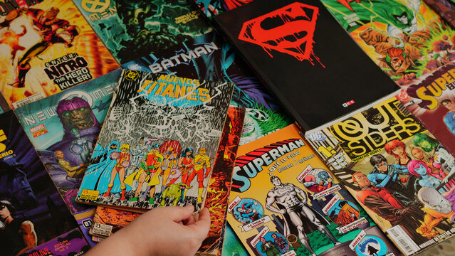 Guayaquil, Ecuador - AUG 10, 2024: Collection of vintage comic books, including Superman, Batman, and other iconic superheroes.